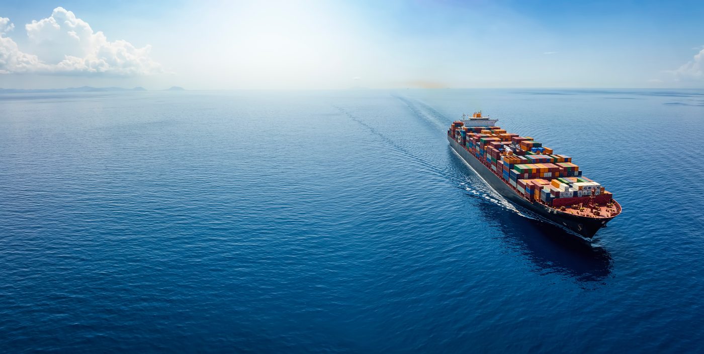 Container ship sailing across the open sea